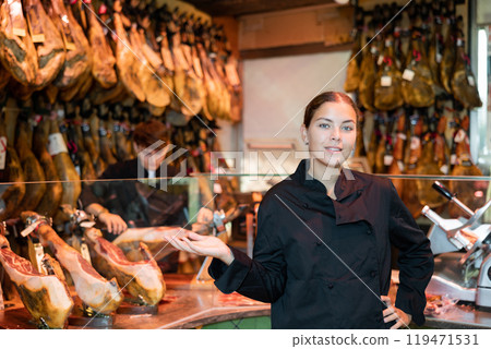 Portrait of positive young woman jamoneria worker Portrait of positive young woman jamoneria worker 119471531
