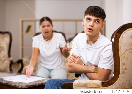 Angry young woman swears at her spouse 119471759