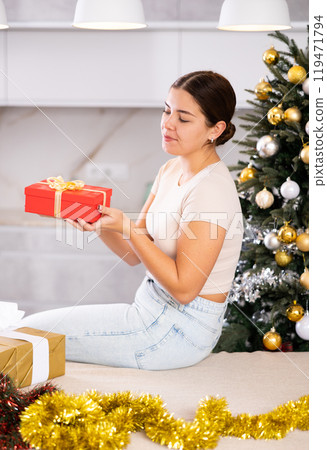 prepearing for New Year and preparing surprises, girl picked up most beautiful gift 119471794