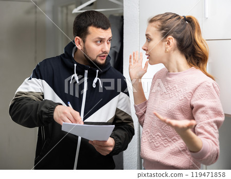 Man asking frustrated confused woman sign papers 119471858