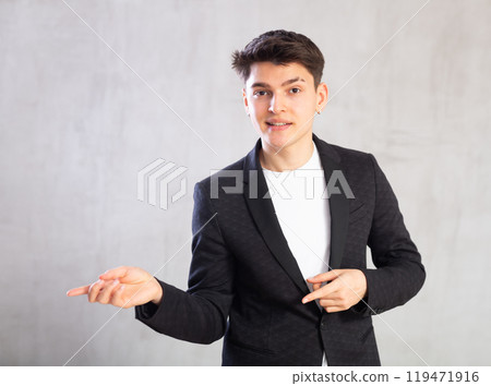Portrait of smiling young guy in business clothes Portrait of smiling young guy in business clothes 119471916