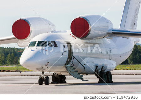 Transport aircraft with open airstair on the airport apron Transport aircraft with open airstair on the airport apron 119472910