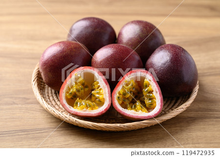 Passion fruit in basket on wooden background, Tropical fruit 119472935