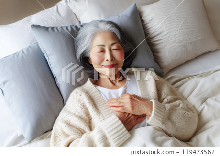 Elderly woman sleeping comfortably Elderly woman sleeping comfortably 119473562