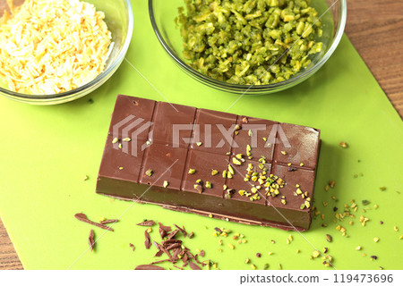 Dubai chocolate with pistachio paste and kataifi dough. Confectionery food and sweets with your own hands at home in the kitchen. Dubai chocolate with pistachio paste and kataifi dough. Confectionery food and sweets with your own hands at home in the kitchen. 119473696