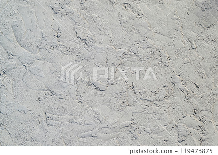 White wall texture roughly finished with a trowel 119473875