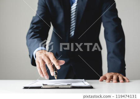 Business man employer holding resume hiring recruit looking cv resume to hire candidates, analyzing information before job interview. Recruitment concepts 119474131