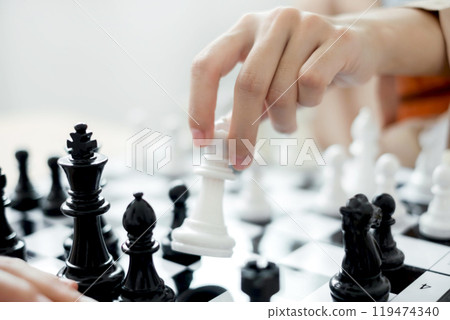 hand of business moving chess in competition shows leadership, followers and business success strategies 119474340