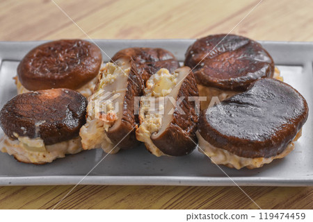 Shiitake mushrooms stuffed with chicken 119474459