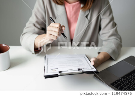 Business woman employer holding resume hiring recruit looking cv resume to hire candidates, analyzing information before job interview. Recruitment concepts 119474576