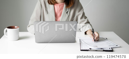 Business woman employer holding resume hiring recruit looking cv resume to hire candidates, analyzing information before job interview. Recruitment concepts Business woman employer holding resume hiring recruit looking cv resume to hire candidates, analyzing information before job interview. Recruitment concepts 119474578