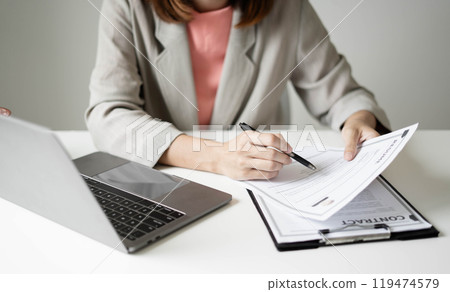 Business woman employer holding resume hiring recruit looking cv resume to hire candidates, analyzing information before job interview. Recruitment concepts Business woman employer holding resume hiring recruit looking cv resume to hire candidates, analyzing information before job interview. Recruitment concepts 119474579