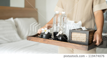 The housekeeper hotel cleans and arranges things in order. prepares to welcome VIP guests The housekeeper hotel cleans and arranges things in order. prepares to welcome VIP guests 119474876