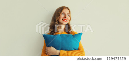 Healthy sleep, happy woman hugs her soft comfortable pillow imagining that she is lying on the bed Healthy sleep, happy woman hugs her soft comfortable pillow imagining that she is lying on the bed 119475859