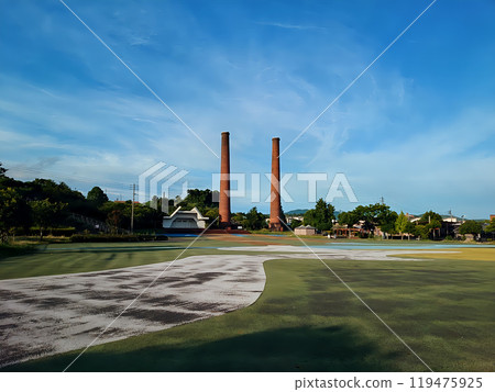 Stroll through the park with two chimneys at dusk Stroll through the park with two chimneys at dusk 119475925