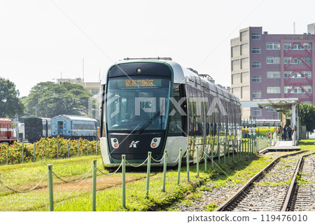 The circular light rail train drives past Hamasen Railway Cultural Park in Kaohsiung, Taiwan. 119476010