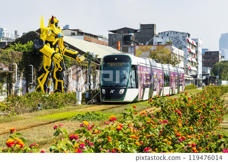 The circular light rail train drives past Pier-2 Art Center in Kaohsiung, Taiwan. The circular light rail train drives past Pier-2 Art Center in Kaohsiung, Taiwan. 119476014