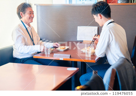 Two businessmen having lunch in a restaurant 119476055