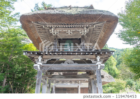 Shirakawa village, Gifu, Japan. A traditional wooden building with a thatched roof 119476453