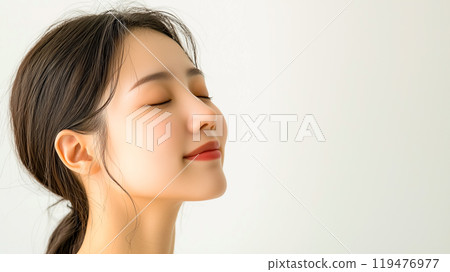 Dreamy profile of a woman with perfect glowing skin Dreamy profile of a woman with perfect glowing skin 119476977