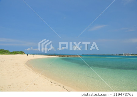People strolling along the beautiful white sand beach at Kurima Fishing Port Beach 119478762