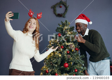 Celebrating Christmas by Decorating Christmas Tree Celebrating Christmas by Decorating Christmas Tree 119480103