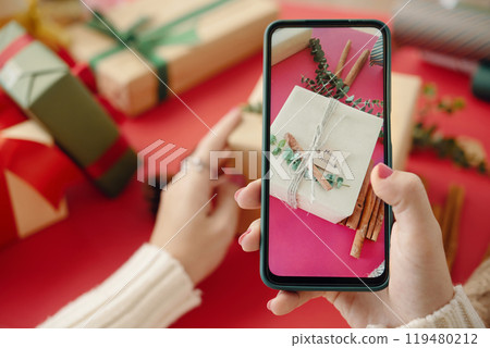Capturing Holiday Gift Wrapping on Smartphone Capturing Holiday Gift Wrapping on Smartphone 119480212