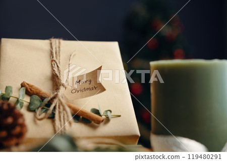 Christmas Gift Box with Candle and Pine Cone 119480291