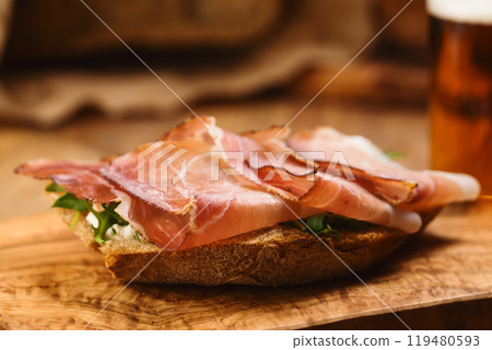 italian sandwich with speck and arugula 119480593