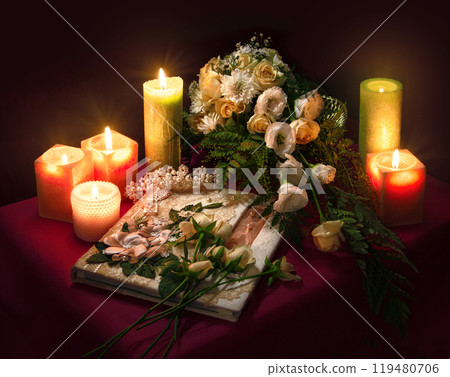 Wedding album for guests among flowers and candles 119480706