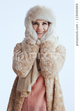 smiling stylish 40 year old woman looking up on white 119480869