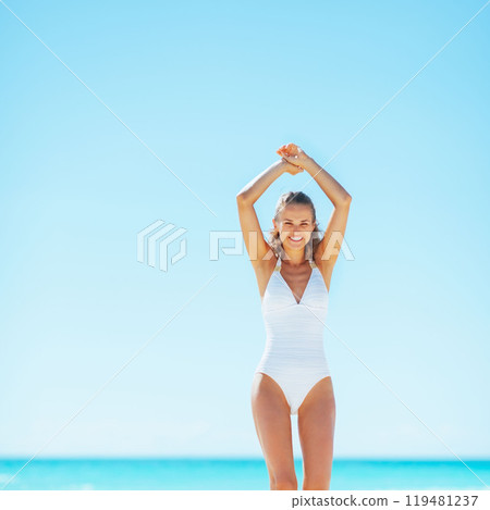 happy young woman on beach happy young woman on beach 119481237