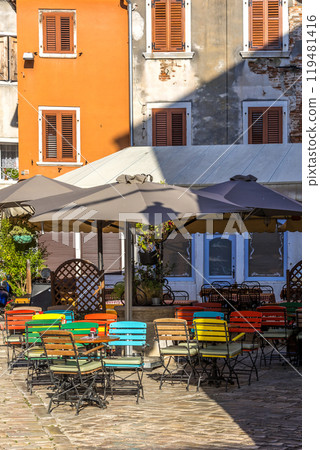 Rovinj, Croatia street with cafe, colorful chairs Rovinj, Croatia street with cafe, colorful chairs 119481416