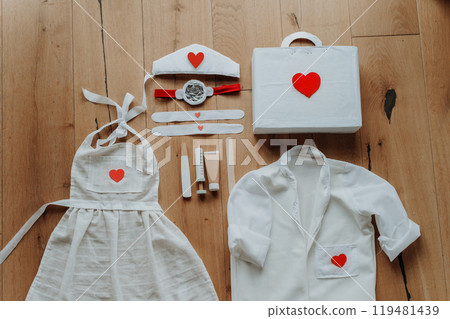 Imaginative play for children, playing hospital. Toys and equipment for little doctors. 119481439