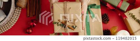 Wrapping Christmas Gift with Rustic Decoration 119482015