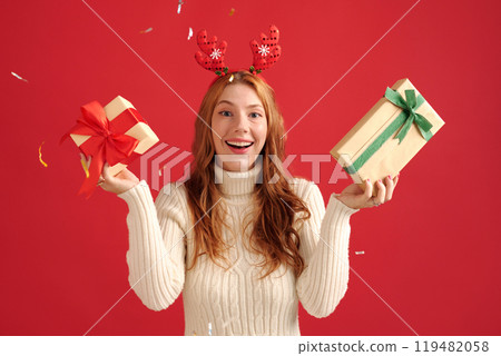 Celebrating Holiday Season with Gift Boxes and Cheer 119482058
