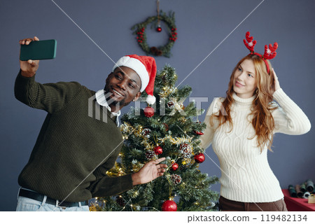 Celebrating Holiday Season with Friends and Festive Spirit Celebrating Holiday Season with Friends and Festive Spirit 119482134