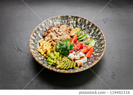 Colorful Buddha bowl with fresh vegetables, quinoa, and avocado, healthy eating and wellness lovers Colorful Buddha bowl with fresh vegetables, quinoa, and avocado, healthy eating and wellness lovers 119482316
