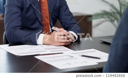 Hands of businessmen having a meeting Hands of businessmen having a meeting 119482608