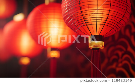 Illuminated hung red golden lanterns during Chinese Happy New Year festival 119483149