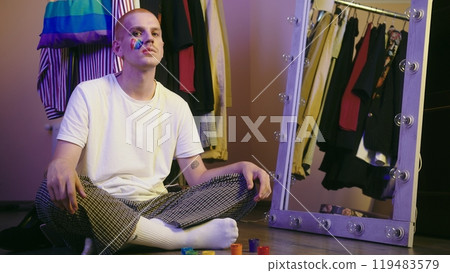Portrait of an LGBT Individual in Dressing Room Mirror Reflection Portrait of an LGBT Individual in Dressing Room Mirror Reflection 119483579