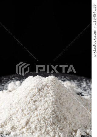 Close-up of natural coconut flour on a black background 119484119