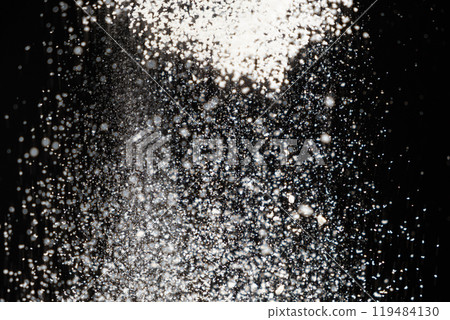 Abstract black and white background of pouring flour, space for text Abstract black and white background of pouring flour, space for text 119484130