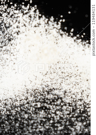 Abstract black and white background of pouring flour, space for text Abstract black and white background of pouring flour, space for text 119484131