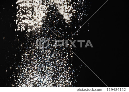 Abstract black and white background of pouring flour, space for text Abstract black and white background of pouring flour, space for text 119484132