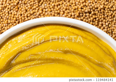 Mustard sauce and dry mustard seeds, top view. Mustard sauce and dry mustard seeds, top view. 119484141