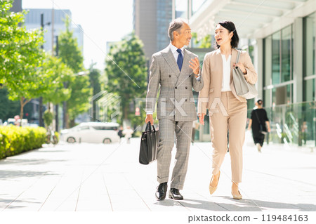 Business people talking in an office district Business people talking in an office district 119484163