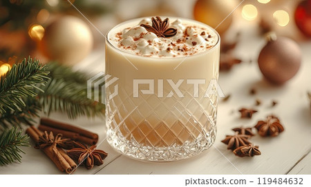 Christmas drink with cinnamon sticks and anise stars, glasse of sweet classic eggnog cocktail on Christmas, New Year decorated background with fir tree and baubles 119484632