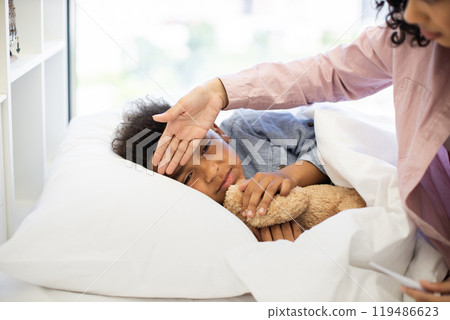Caring for sick child with loving attention and comfort Caring for sick child with loving attention and comfort 119486623