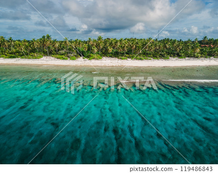 Maldives coastline with beach, palms trees and clear ocean. Maldives coastline with beach, palms trees and clear ocean. 119486843